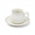Close-up White Ceramic Cup with Gold Rim